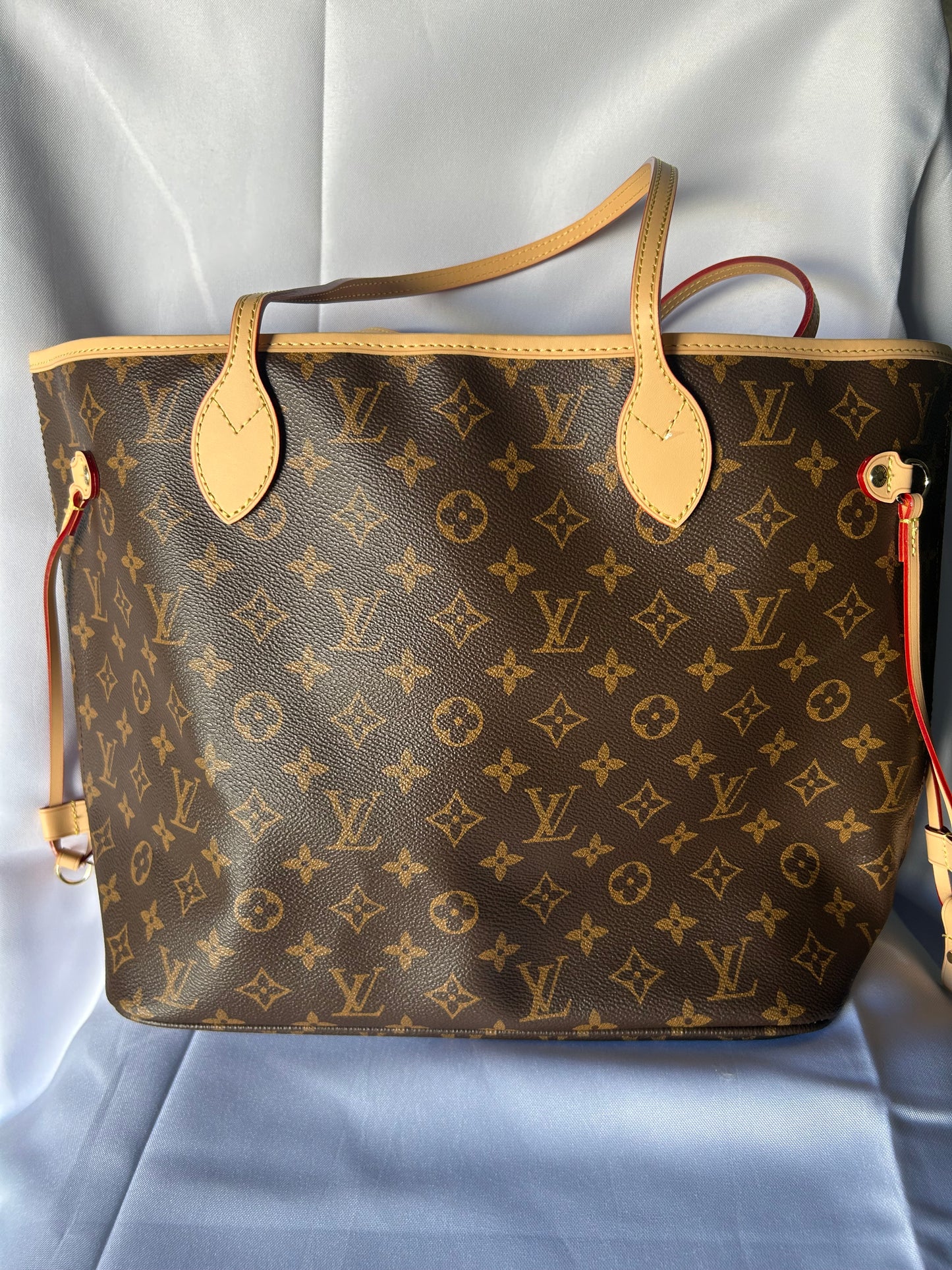 Luxury inspired oversized everyday tote bag with matching pouch.
