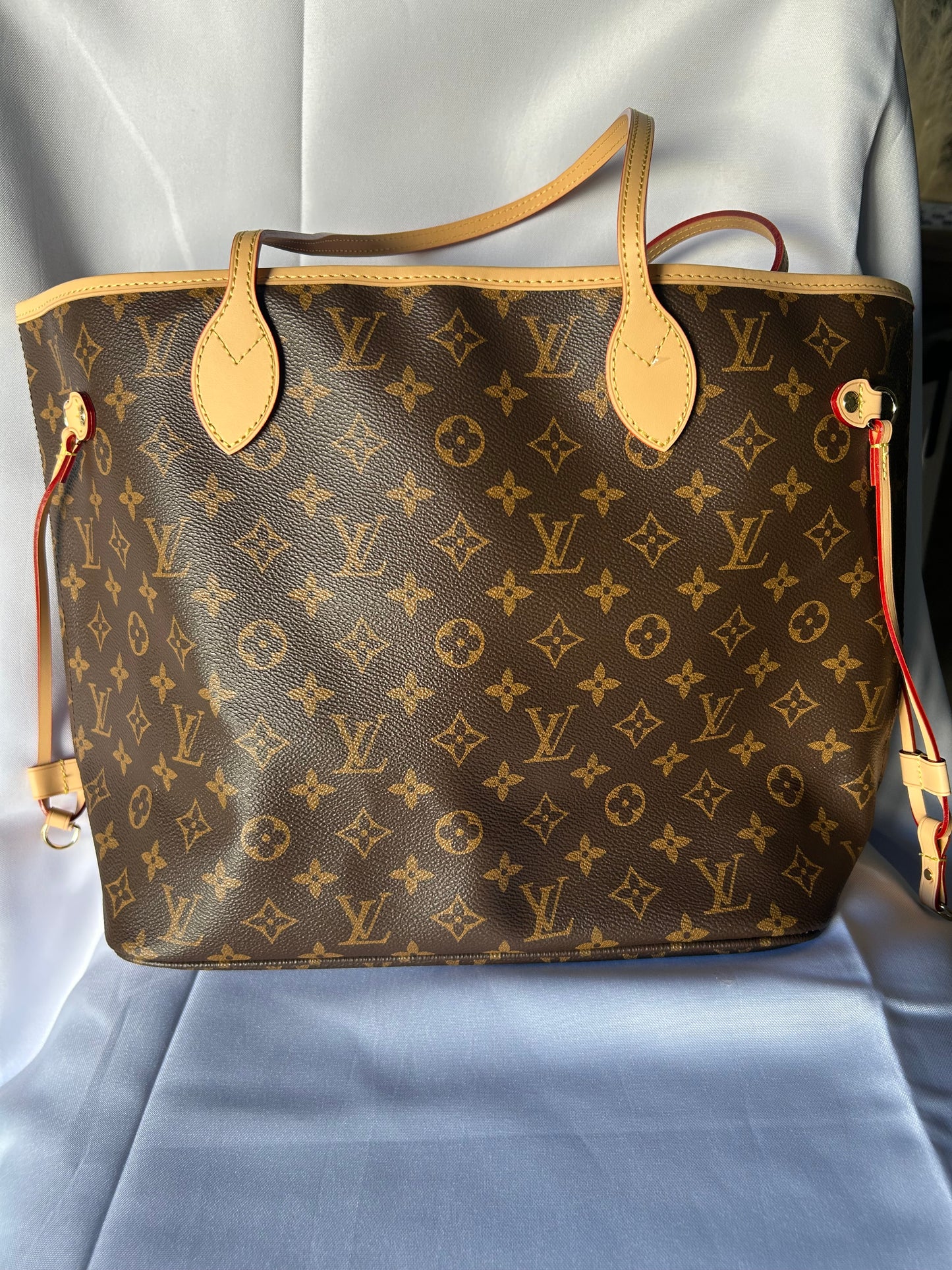 Luxury inspired oversized everyday tote bag with matching pouch.